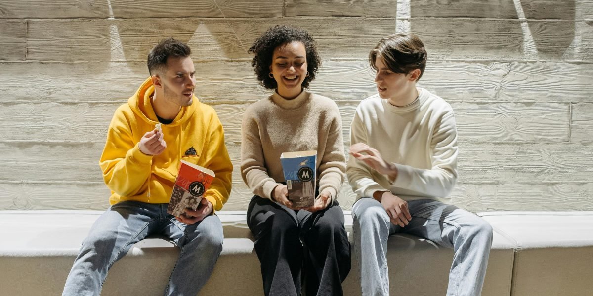 Friends gathered, discussing their favorite classic science fiction films from the 1990s.