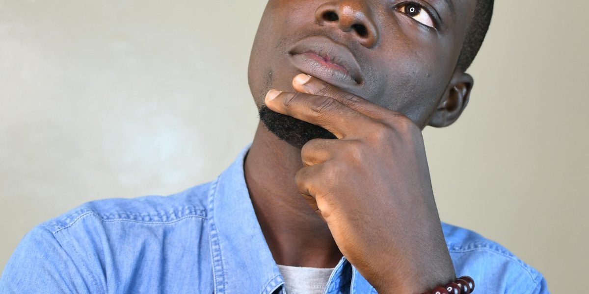 A person in contemplation, symbolizing the profound questions posed by films like 'The Matrix'.