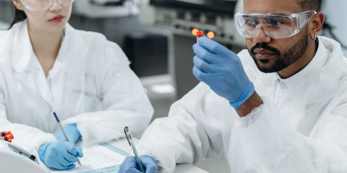Scientists intently working together, reflecting the grounded, research-focused approach of 'Contact'.
