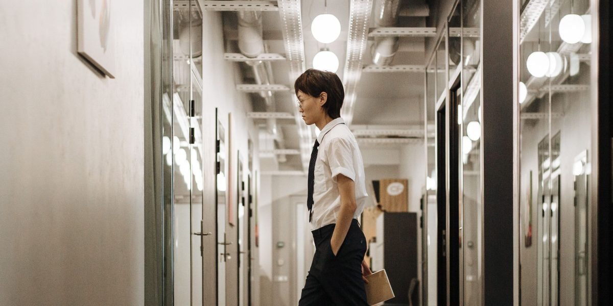 A person looking thoughtfully at a timeline or chart, symbolizing a career's progression and evolution.