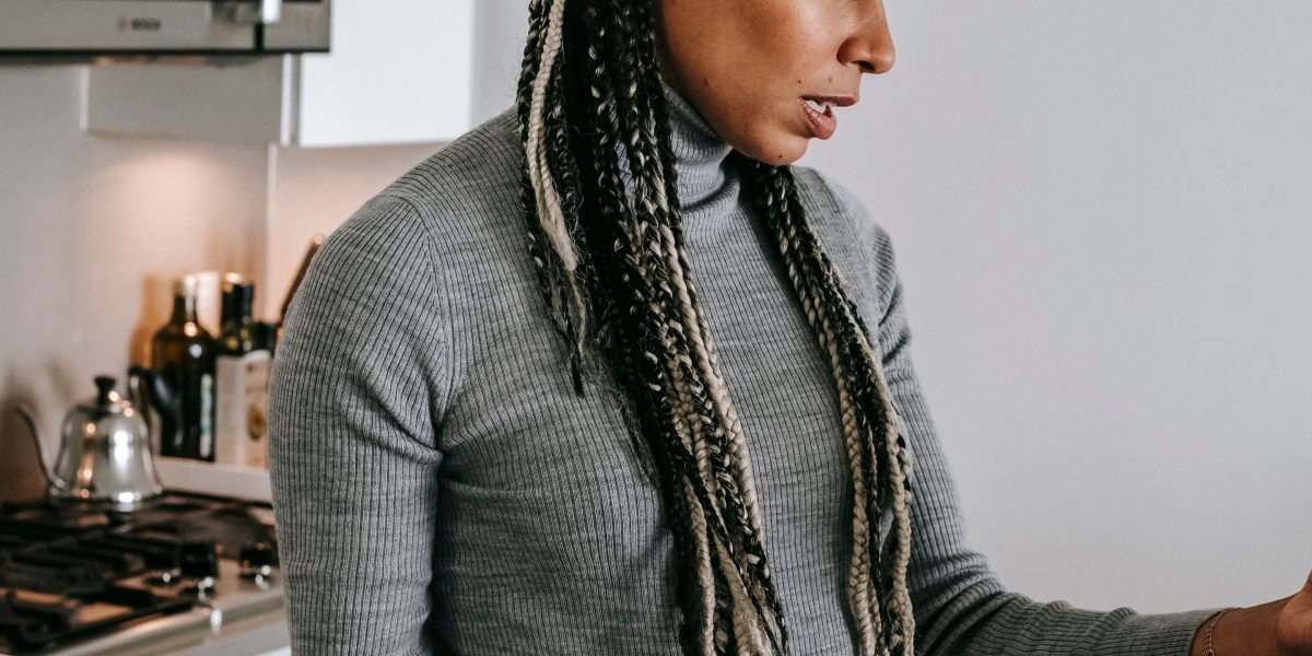 A person looking overwhelmed while scrolling through numerous movie options on a streaming platform, illustrating 'discovery fatigue.'